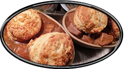 beef bacon onion cobbler with cheese scones on top
